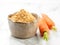 Bowl of dried carrot powder