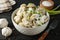 Bowl with dumplings and spices on background, close up