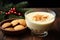 a bowl of eggnog and a festive cookie pile on a wooden table