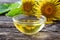 A bowl of elecampane essential oil with fresh plant