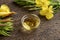 A bowl of evening primrose oil with blooming evening primrose
