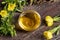 A bowl of evening primrose oil with fresh evening primrose flowers
