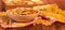 A bowl of farfalle, bunch of spaghetti, nest of thin vermicelli, noodles and box with various pasta on red background.