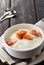 Bowl of fresh mixed berries and yogurt with farm fresh Papaya on a wooden table