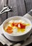 Bowl of fresh mixed berries and yogurt with farm fresh Papaya on a wooden table