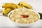 Bowl of fresh oatmeal porridge with banana