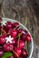 Bowl of fresh red cherries on wooden background, close up,  vertical composition - Image