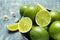 Bowl with fresh ripe limes on table