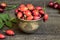 A bowl with fresh rosehips