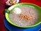 Bowl of freshly cooked rice porridge with egg and pork innards