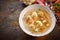 Bowl of German spring soup on a rustic table