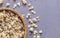 Bowl of granola close-up. Top view. Scattered granola on table surface.