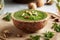 A bowl of green pesto made of young cow parsley leaves