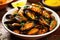 bowl of grilled mussels revealed inside