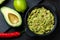 Bowl of guacamole with fresh ingredients