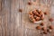 Bowl with hazelnuts on wooden table