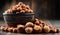 Bowl with hazelnuts on wooden table.