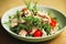 Bowl with healthy appetizing tuna salad with small tomatoes and lettuce leaves