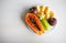 Bowl of healthy fresh fruit salad on white background. Top view. Mangosteen, papaya, carambola, jackfruit.