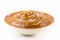 Bowl with homemade dulce de leche, condensed cream or doughy caramel, isolated white background