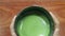 Bowl of hot matcha green tea drinking