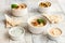 Bowl of hummus, traditional Jewish, Arabian, Middle Eastern food from chick-peas with deeps and with  pita flatbread on ceramic