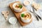 Bowl of hummus, traditional Jewish, Arabian, Middle Eastern food from chick-peas with deeps and with pita flatbread on ceramic