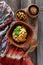 Bowl of hummus, traditional Jewish, Arabian, Middle Eastern food from chick-peas with dip tahini and olives on vintage wooden