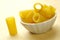 Bowl of italian rigatoni pasta - wooden background