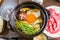 Bowl of Japanese Sukiyaki hot pot with vegetables and soup