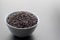 Bowl of jasmine black rice on black backgrounds