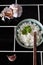 Bowl of jasmine rice chopsticks and garlic