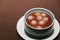 A bowl of jiuniang yuanzi on table