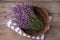 Bowl with lavender flowers on wooden table