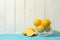 Bowl with lemons on table. Ripe fruit