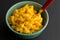 Bowl of macaroni and cheese with spoon