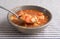 Bowl of Manhattan style chowder with spoonful