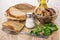 Bowl with marinated lactarius, bread in wicker basket, salt, pep