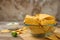 Bowl of Mexican nacho chips on wooden table