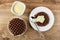 Bowl with milk, wafer in saucer, wafer in chocolate poured condensed milk, spoon in plate, on wooden table. Top view