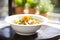 bowl of minestrone, focus on tomato chunks