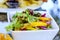 Bowl of Mixed Colourful Summer Salad On A Table