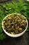 Bowl of moringa leaf stir fry vegan diet food.