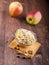 Bowl of muesli, apple, nuts, flakes, candied for a nutritious b