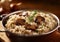 Bowl of mushroom risotto rice on wooden table.Macro.AI Generative