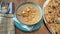 Bowl of mushroom soup with croutons on rustic wooden background