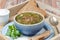 Bowl of mushroom soup with pearl barley on a tray