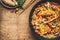 Bowl with noodles or pasta with vegetarian creamy sauce on rustic wooden background, top view, place for text. Healthy eating and