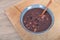 A bowl of nutritious laba porridge and a wooden spoon