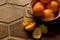 Bowl of oranges on Spanish tile floor